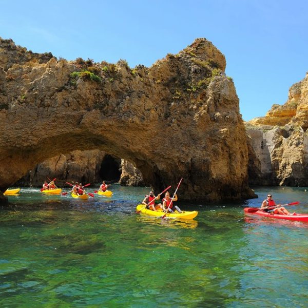 lagos caves and people on kayaks
