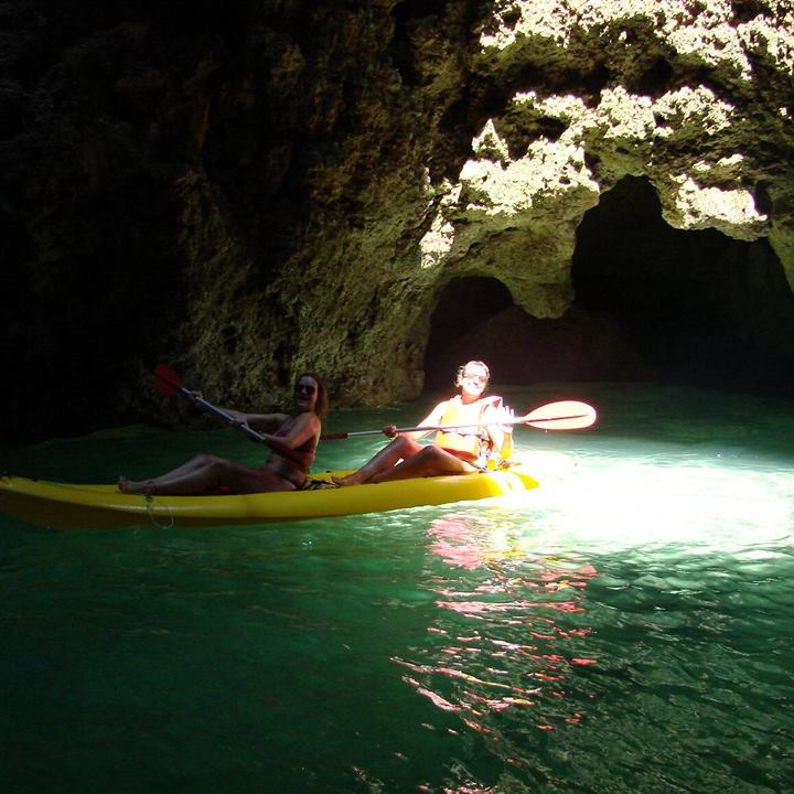 two girls inside a cave
