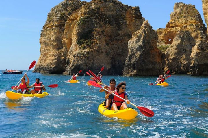 Lagos Beach and people kayaking