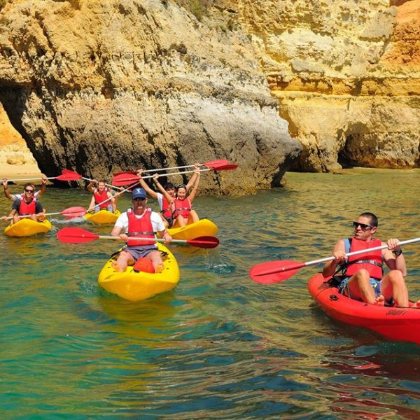 a guide and a group during a kayak tour